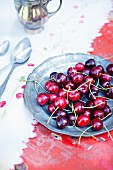 Fresh cherries on a pewter plate