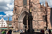 People around Freiburg Minster, Germany