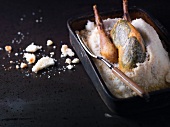 Guinea fowl with herbs in salt