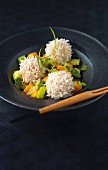 Prawn balls wrapped in rice with a mango and cucumber salad