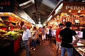People shopping food form market stalls in Barcelona, Spain