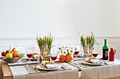 Beautifully decorated table with crockery and wine glasses