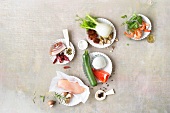 Vegetables, meat and other fresh ingredients on chopping board