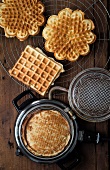 Close-up of round waffle maker with cooked waffle