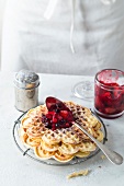 Choux waffles with berry compote on plate