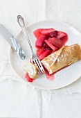 Sour cream with pancakes on chopping board