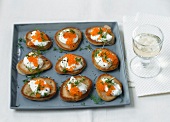 Blini with trout caviar on plate