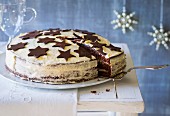 A Christmas cake made with mulled wine and gingerbread spice and decorated with chocolate stars