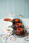 Mini macadamia nut and chilli Bundt cakes served with tea and coffee