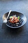 Black linguine with bolognese sauce
