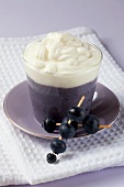 A blueberry dessert with cream