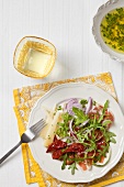 Rocket salad with dried tomatoes and cheese