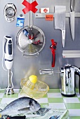 Various kitchen utensils and devices (mechanical and electric) and fish