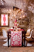 A festively laid table for Christmas dinner in a vaulted cellar