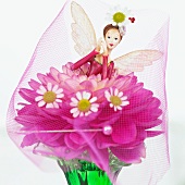 Decorative fairy on a dahlia flower