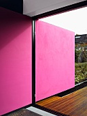 Pink wall in a living room on a terrace