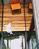 Leather chair on a wooden terrace in a courtyard