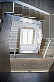 A view through a contemporary stairwell to a skylight