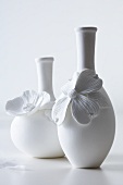 White vases decorated with flowers