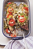 Aubergines stuffed with orzo pasta, tomatoes and feta cheese