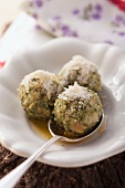 Spinach dumplings with Parmesan and melted butter