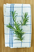 Rosemary sprigs on a tea towel