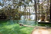 Two people swimming in pool