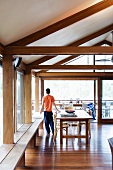 Spacious dining room with benches along the long glass wall