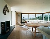 Open-plan living and dining room with panoramic window