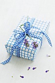 A present decorated with lavender flowers