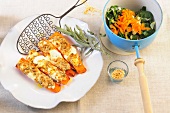 Oven baked carrots with sage and sesame spinach