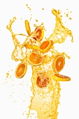 Orange slices and a splash of orange juice