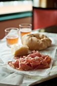 Prosciutto and Bread on a Table at an Italian Market in Baltimore Maryland