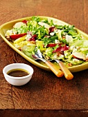 A mixed leaf salad with apples, walnuts and blue cheese