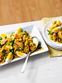 Rice with salmon, egg and peas