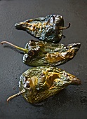 Roasted poblano chillis being peeled