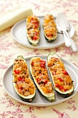Courgettes filled with chicken, peppers and rice