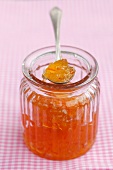 Marmalade in a jar and on a spoon