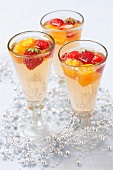 Champagne cocktails made with tonic water, oranges and strawberries