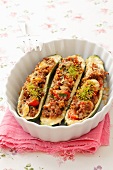 Courgettes stuffed with minced meat, pearl barley and tomatoes