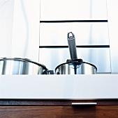 Stainless steel pots in kitchen