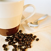 Coffee beans and a coffee cup