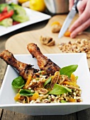 Chicken legs with dried fruits and barley