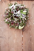 A green and white Christmas wreath