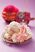 Macaroons and meringues on a silver plate