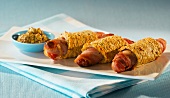 Pigs in blankets with bacon and mustard