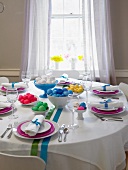 Easter Table Set with Bowls of Colored Easter Eggs