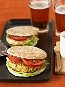 Glazed Turkey Burger with Tomato and Lettuce on Round Flat Bread