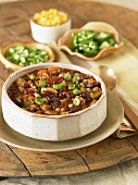 Bowl of Chili Con Carne with Assorted Toppings