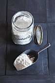 Flour in storage jar and on scoop